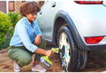Load image into Gallery viewer, Person using a power tool on a car tire