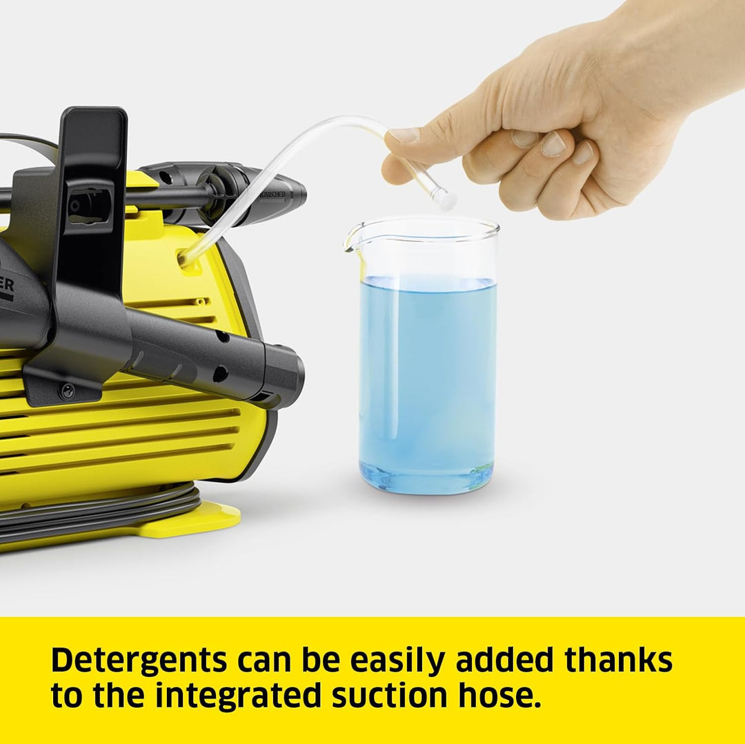 Hand adding blue liquid to a Karcher pressure washer with text about integrated suction hose.