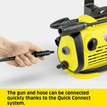 Load image into Gallery viewer, Hand connecting a black gun and hose to a yellow pressure washer with text about the Quick Connect system.