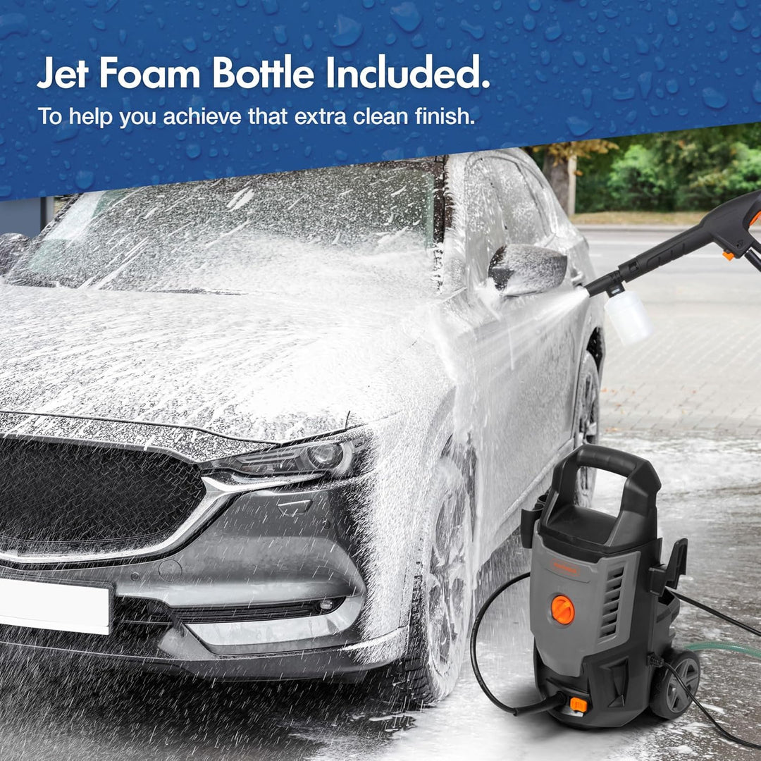 A pressure washer is shown cleaning a white car covered in soap foam outdoors. A blue banner at the top reads 'Jet Foam Bottle Included.